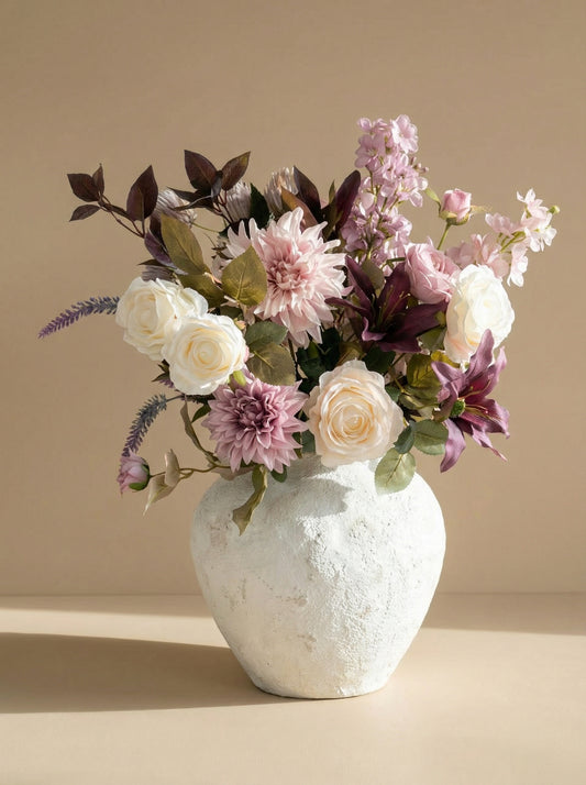 White textured vase with a bouquet of flowers on a beige background