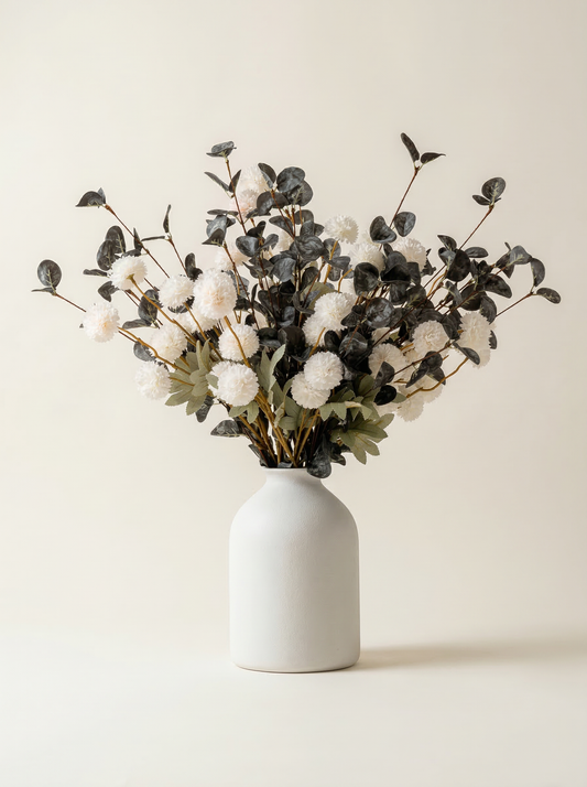 White vase with dried flowers on a beige background